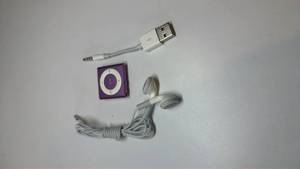 lot 27 image: Apple iPod Shuffle 4th Generation Purple