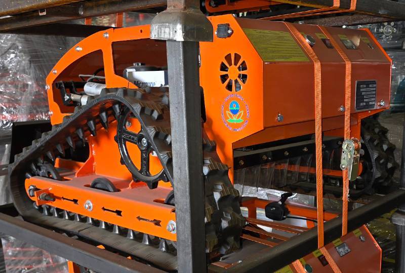 lot 7000 image: Unused Starvox SV-750P Remote Control LawnSlope Mower  Snow Pusher with Dozer Blade - Engineered for Efficient & Safe Mowing on Steep Slopes, Uneven Terrain and Under Machinery, Brush & Vehicles.
