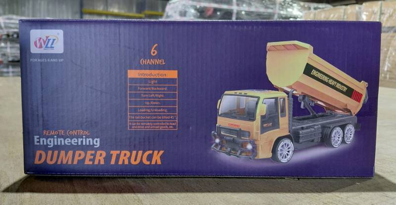 lot 5803 image: Remote Control Engineering Dump Truck - 6 Channel - Light - ForwardBackward - Turn LeftRight - UpDown - LoadingUnloading - Bucket Can Lift 45 Degrees - It Can Be Remotely Controlled to Load and Drive and Unload Goods, Etc.