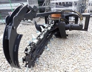 lot 4555 image: Unused JCT Skid Steer Trencher - Heavy-Duty Steel Build with High-Performance Chain and Teeth
