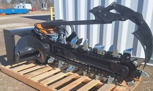 lot 4556 image: Unused JCT Skid Steer Trencher - Heavy-Duty Steel Build with High-Performance Chain and Teeth