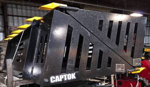 lot 8625 image: Captok model CK-RB66 rock bucket attachment designed for skid steer loaders. Constructed for heavy-duty rock handling and material sifting with durability and strength