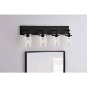 lot 23818 image: Hampton Bay Regan 29.25 in. 4-Light Matte Black Bathroom Vanity Light with Clear Glass Shades