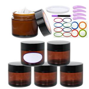 lot 54119 image: 2oz Small Travel Containers with Black Lids,6 Pack Amber Glass Jars with Mini Disposable Spatula for Toiletries��Travel Storage��Makeup Beauty Products, Lotions, Powders and Ointments - Retail $12