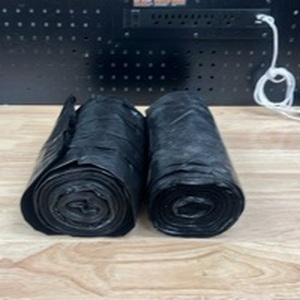 lot 4287 image: 2-Rolls of Black Trash Bags. 30-40 Gallon - Retail $0