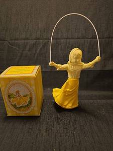 lot 5313 image: Avon Skip-a-Rope Roses Roses Cologne with Figure