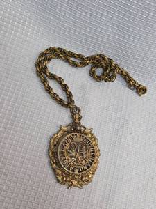 lot 415 image: Gold Tone Ornate Medallion Pendant Necklace