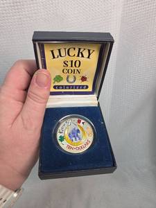 lot 515 image: Lucky $10 Colorized Good Fortune Coin
