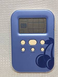 lot 543 image: Radica Lighted Slot Machine Electronic Handheld Game