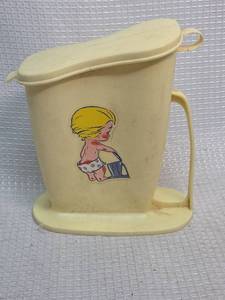 lot 559 image: Vintage Tommee Tippee Little Wee Wee Jug,