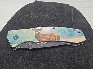lot 566 image: Duck Brand Folding Pocket Knife with Elk Design