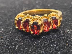 lot 573 image: Ring with Red Garnets