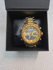lot 610 image: Beautiful Daniel Steiger Gold Digital-Analog Watch, in brand new condition