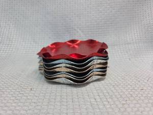 lot 611 image: Red and Silver Wavy Metal Coasters