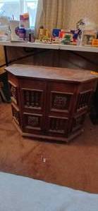 lot 26848 image: Vintage Spanish Mediterranean Style Hexagonal Storage Accent End Table full of Several Gardening Books and Maps