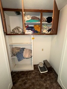 lot 27129 image: Closet Full of Towels, Select Clothing Items, and other Bathroom Items