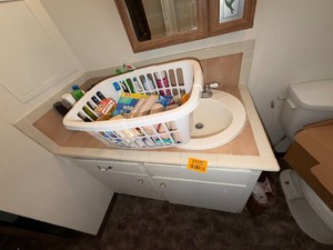 lot 27130 image: Cabinets Full of Various Bathroom Products, Soaps and Cleaning Products