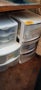 lot 26869 image: Clear and White Plastic Storage Containers Full of a Variety of Office Supplies and Stamps
