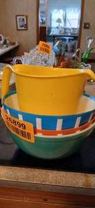 lot 26899 image: Set of Three Colored Plastic Mixing Bowls and Measuring Cup