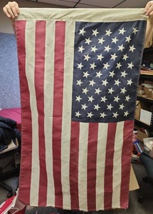 lot 179 image: American Flag - 50W x 30 H - ends are tattered