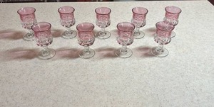 lot 102 image: Vintage Tiffin Franciscan Kings Crown Thumbprint Cranberry Flash Cordial Goblets (mini size for liquor) set of 9- some have fade in the cranberry flashing