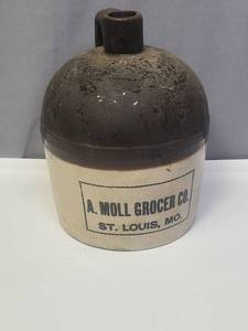 lot 125 image: A. Moll Grocer Co. St. Louis Stoneware Jug (needs a good scrubbing)