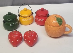 lot 128 image: Vintage Ceramic Kitchen Condiment Set - Mustard, Ketchup and Relish kettles, sugar bowl shaped like an orange, and Strawberry shaped salt & pepper shakers