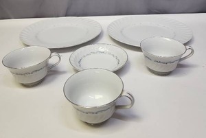 lot 133 image: Celebrity Fine China Evening Tide Pattern (bluegray scroll motifs), Platinum Trimmed Dinnerware - 2 dinner plates, 3 cups, one saucer (or maybe it is a condiment tray)