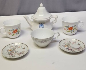 lot 134 image: Mixed Porcelain Tea Ware - cups, saucers, and pitcher.  Saucers may be trinket trays (Avon).