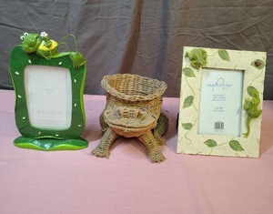 lot 166 image: Frog Decor - ceramic picture frame with 3d FrogLeaves, Plastic Frog picture frame, and a wicker frog basket