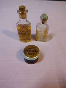 lot 169 image: Edison Diamond Oil and Grease Bottle Set - oil still in one bottle, grease still in the jar