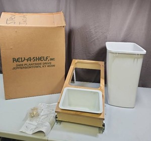 lot 438 image: Rev-A-Shelf Pull-Out Waste Container System - has one area for waste bin and another area for a small bin - appears new in open box