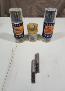 lot 504 image: 3 jars of drill bits including Black & Decker, and a few other loose drill bits - each jar is missing a few drill bits but mostly full