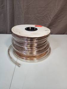 lot 512 image: Clear Vinyl Tubing Roll - original size 34 x 58 x100 - looks to have had very little used off the roll