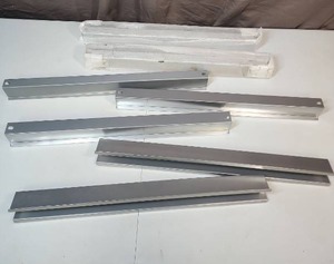 lot 521 image: Aluminum brackets with hollow centers - could be used for wiring covers