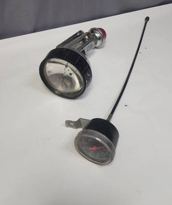 lot 602 image: Vintage Radar-Lite Rail Light by Burgess - untested.  Switch on back red light is stuck and not moving.  And a vintage speedometer