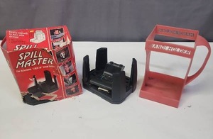 lot 605 image: Spill Master Adjustable Lock-In Drink Holders - qty 2 (one new in box), and a Handi Holder