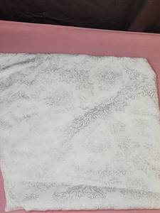 lot 161 image: Round White with shiny brocade pattern table cloth - has a few light stains - could be good crafting fabric