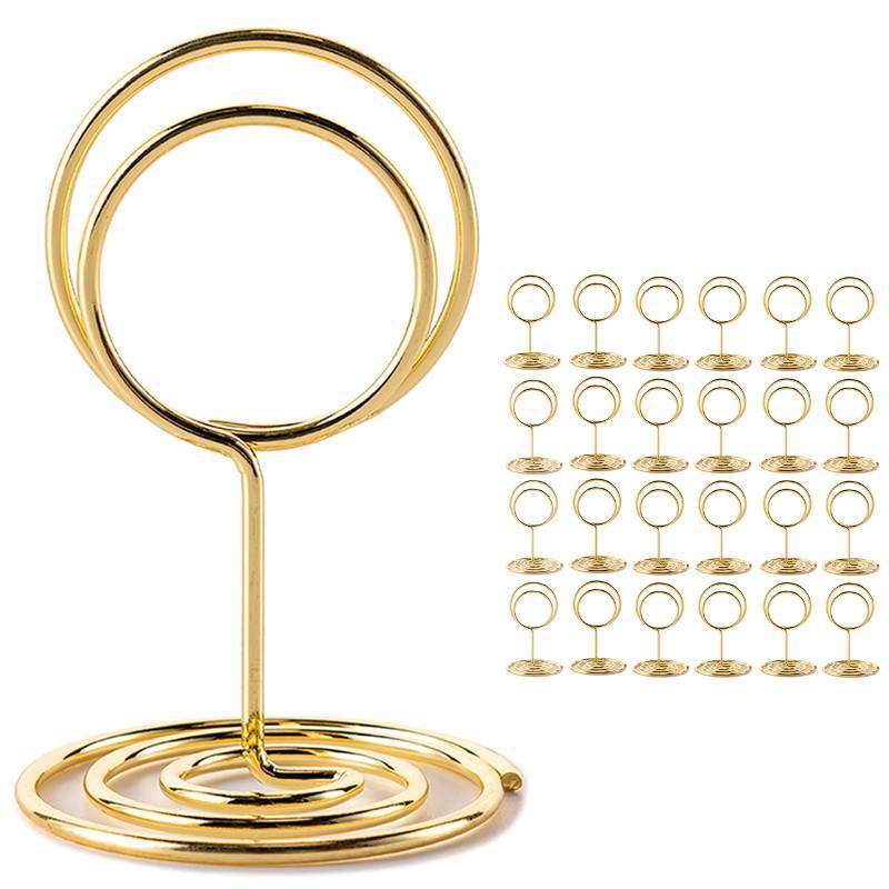 lot 1108 image: 26Pcs Table Number Holders, Place Card Holders, Wire Picture Holders, Small Table Card Holders, Photo Holders for Centerpieces, Wedding Reception, Party, Birthday (Gold) - Retail $13