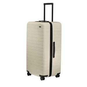 lot 1065 image: Away Large Trunk Luggage, 31 Inch Hardside Suitcase with Spinner Wheels, Lightweight & Durable, TSA Lock, Ideal for Long Trips, Salt White - Retail $455