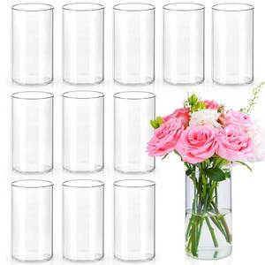 lot 1215 image: UPBUD 6 Inch Glass Cylinder Vases for Centerpieces  12Pcs Clear Small Flower Vase for Wedding Decorations, Floating Candle Vases in Bulk, Hurricane Candle Holders for Table, Home D�cor - Retail $34