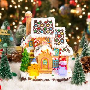 lot 9638 image: LED Lighted Musical Gingerbread House, 7.3 Christmas Village House Decoration with Light-up Gingerbread Cookie and Snowman, Christmas Collectible Buildings for Holiday Decor for Home and Desktop