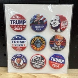 lot 4413 image: 9- Trump Pins - Retail $0