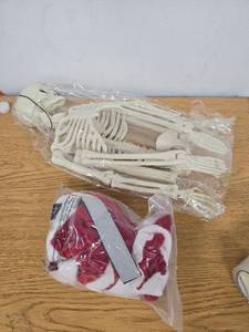 lot 729 image: Porch Goose Christmas Santa Skeleton 25.6 Poseable Skeleton with Santa Suit Hat