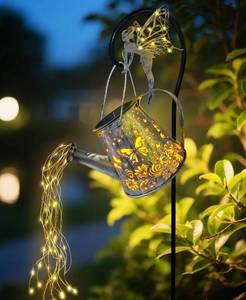 lot 9446 image: Rirool Solar Watering Can Lantern with Fairy Lights - Outdoor Hanging Garden Decor with Shepherd Hook