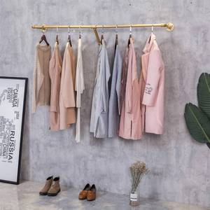 lot 4388 image: FURVOKIA Industrial Pipe Wall Mounted Clothes Hanging Shelves System,Metal Clothing Towel Rack,Garment Rack Perfect for Retail Display,Closet Organization (One Pipe Shelves, Gold, 47 L x 11.8 D) Retail $47