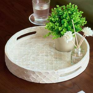lot 48054 image: CHI AN HOME 12.6 Inch Capiz Round Decorative Tray, Decorative Serving Tray with Handles for Coffee Table, Kitchen Counter, Bathroom Vanity or Dining Table Centerpiece Tray, Modern Farmhouse Decor - Retail $31