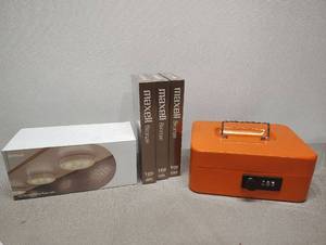 lot 448 image: Orange Security Lock Box 3 Maxell Blank VHS Tapes and New Box of LED motion Sensor Puck Lights