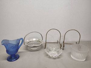 lot 449 image: Clear Glass Basket with Rose Pattern and Metal Frame 2 Plate Holders Blue Glass Pitcher and Clear Glass Dishes