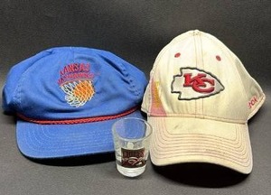 lot 138 image: Kansas City Chiefs and Kansas Jayhawks Baseball Caps with Kansas City Chiefs Medal Shot Glass